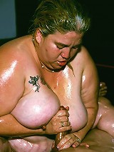 Naughty BBW covered in goo while a horny guy examines her big fat tits and enormous booty live